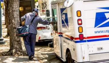 US Postal Service worker makes delivery in Miami.