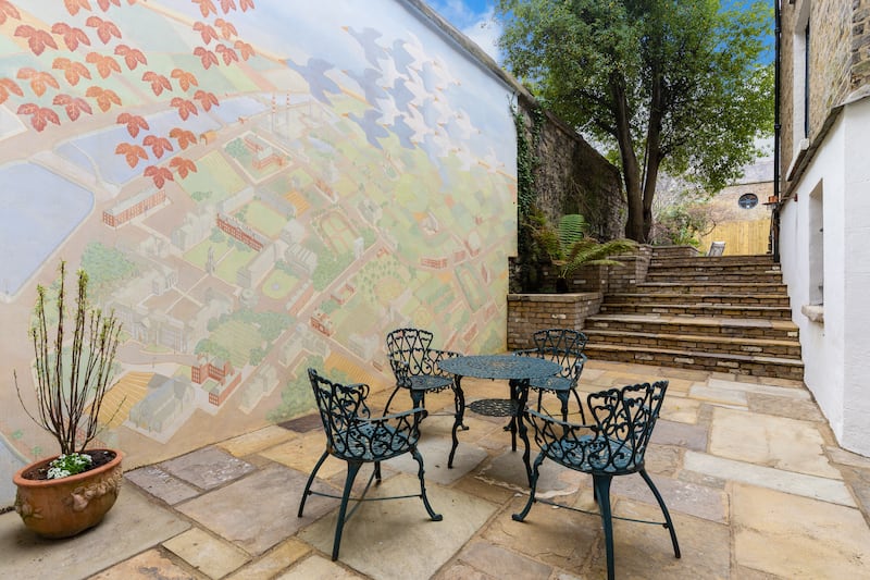 Rear patio with MC Escher-inspired mural of Dublin by Lucretia Moroni