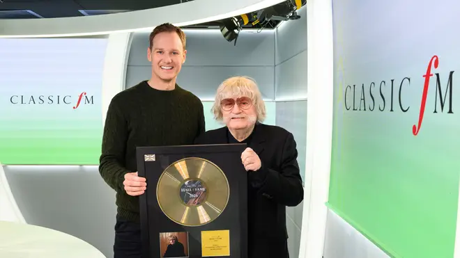 Dan Walker presents Sir Karl Jenkins with a gold disc to celebrate his No.1 entry in the Classic FM Hall of Fame 2026.