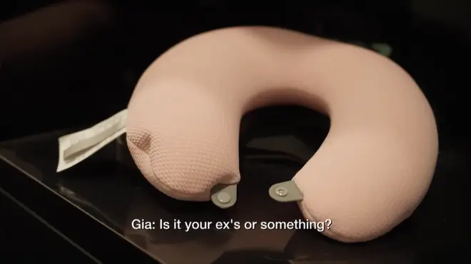 An image of the pink neck pillow.