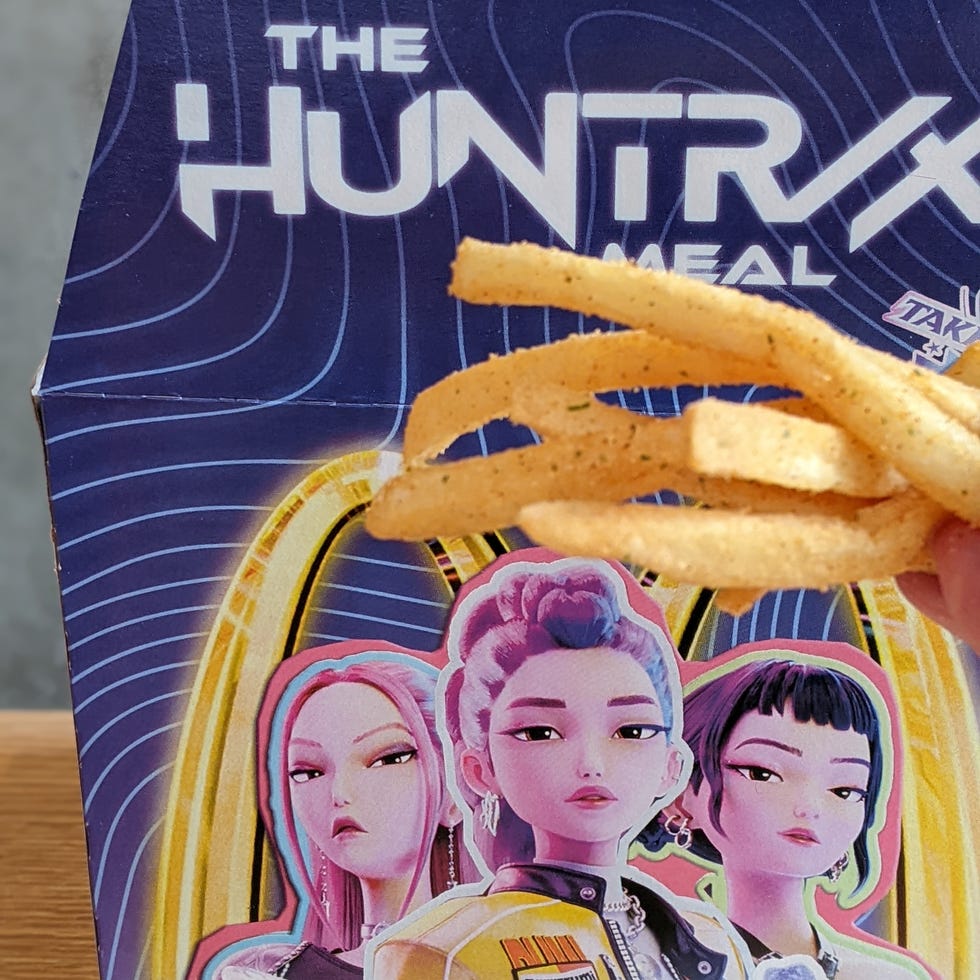 Fried snacks with a branded packaging featuring stylized graphics. Fried snacks with a branded packaging featuring stylized graphics.