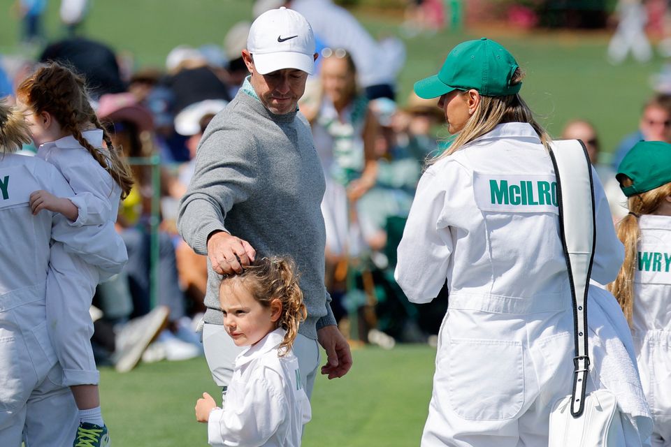 Golf - The Masters - Augusta National Golf Club, Augusta, Georgia, U.S. - April 8, 2026
Northern Ireland's Rory McIlroy with his wife Erica Stoll and daughter Poppy on the 6th hole during the par 3 contest REUTERS/Mike Blake