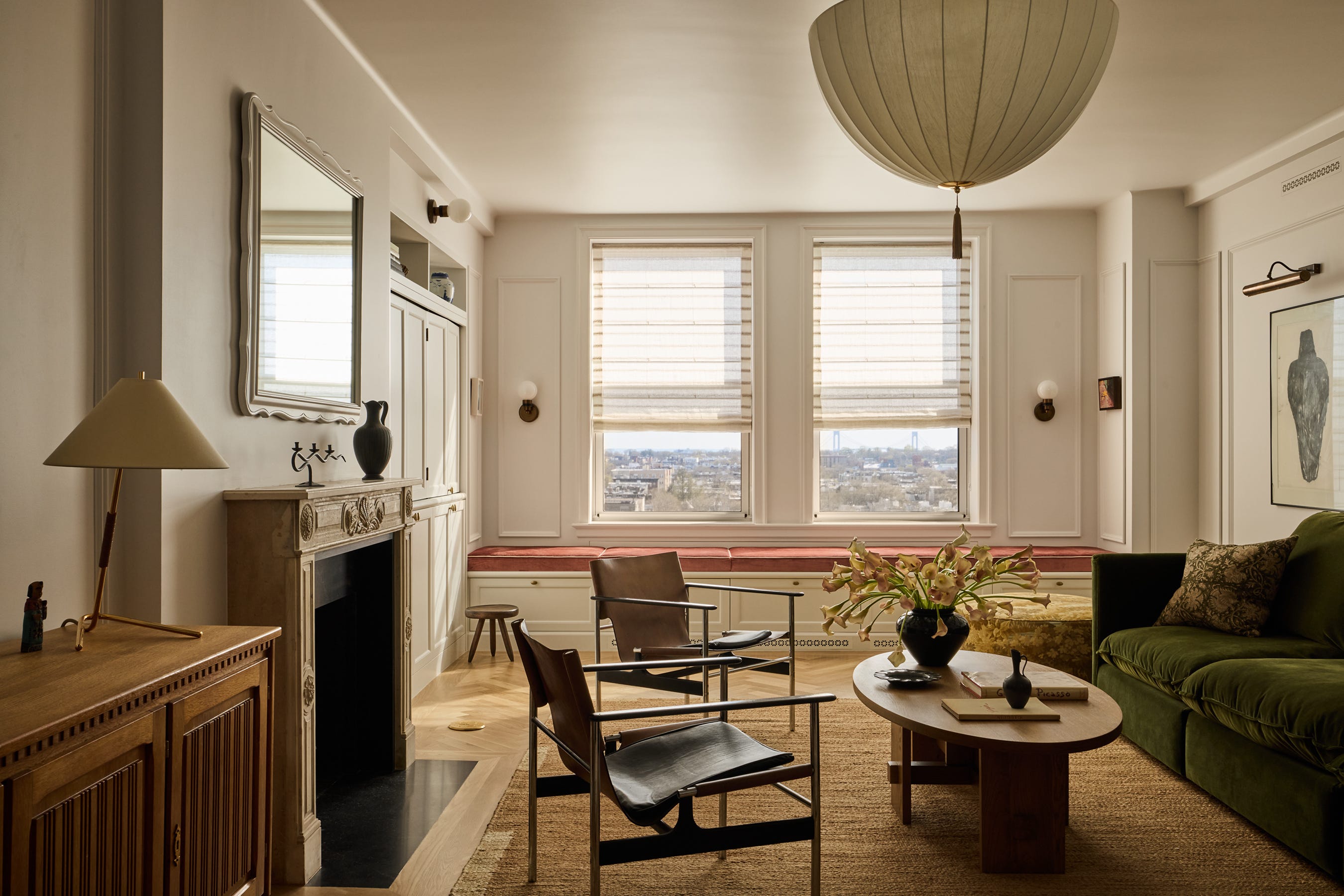 Bright living room featuring modern furniture and large windows.