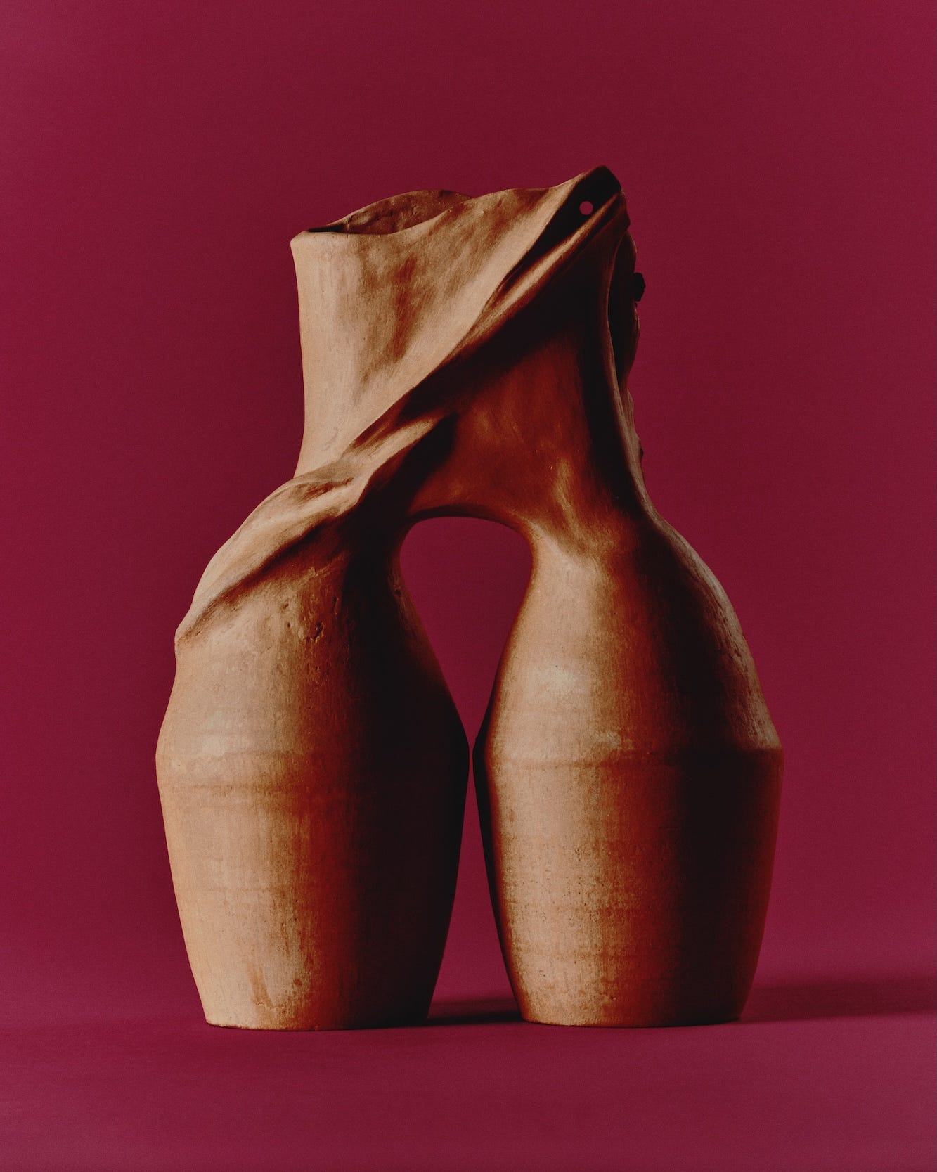 ceramic sculpture with two vessels joined at the top