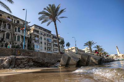 Concrete blocks break waves along the shore of Alexandria, Egypt, where rising seas and sinking land have worsened flooding.