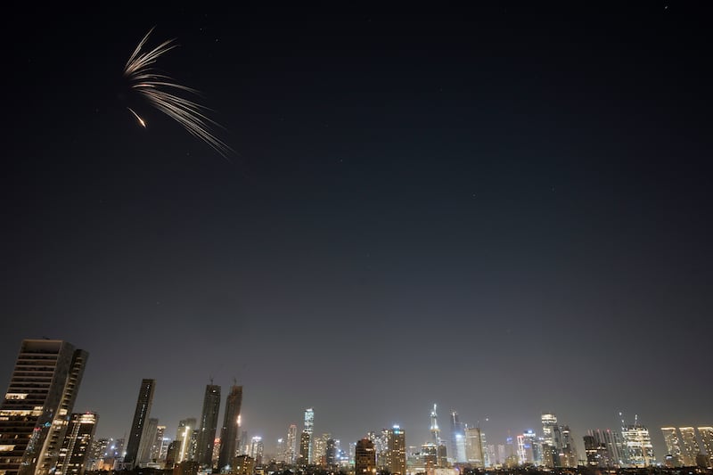 Missiles launched from Iran streak across the sky over central Israel. Photograph: Ohad Zwigenberg/AP