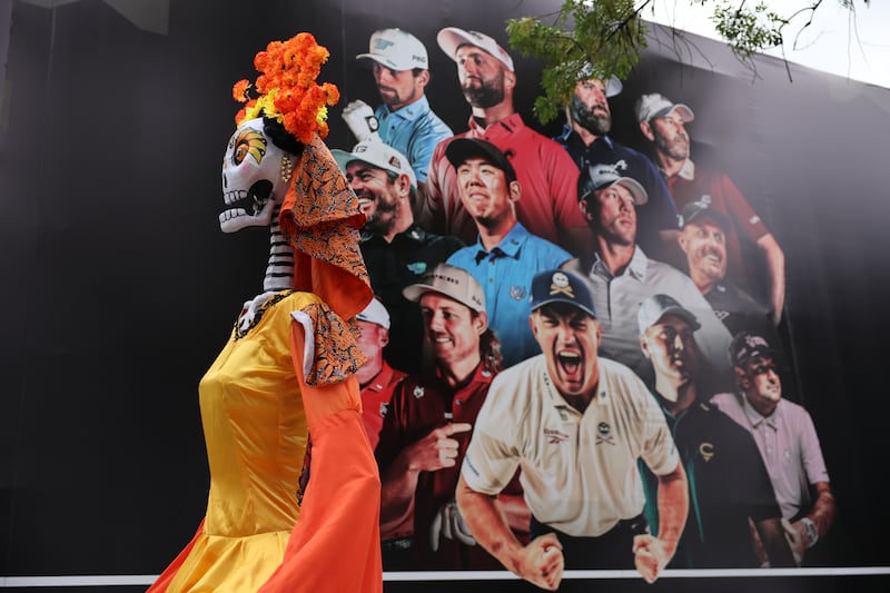 A Mexican Catrina in front of a poster featuring LIV golfers ahead of LIV Golf Mexico City at Club de Golf Chapultepec earlier this month. Photograph: Hector Vivas/Getty Images