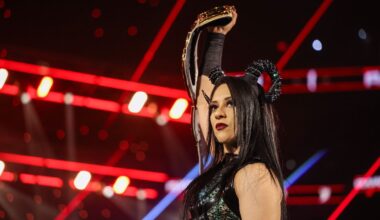 Stephanie Vaquer holding her title belt above her head