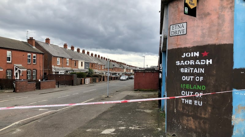 The scene at Etna Drive in the Ardoyne area of Belfast, where Robbie Lawlor  died following a shooting. A burnt-out car was found nearby. Photograph: David Young/PA Wire
