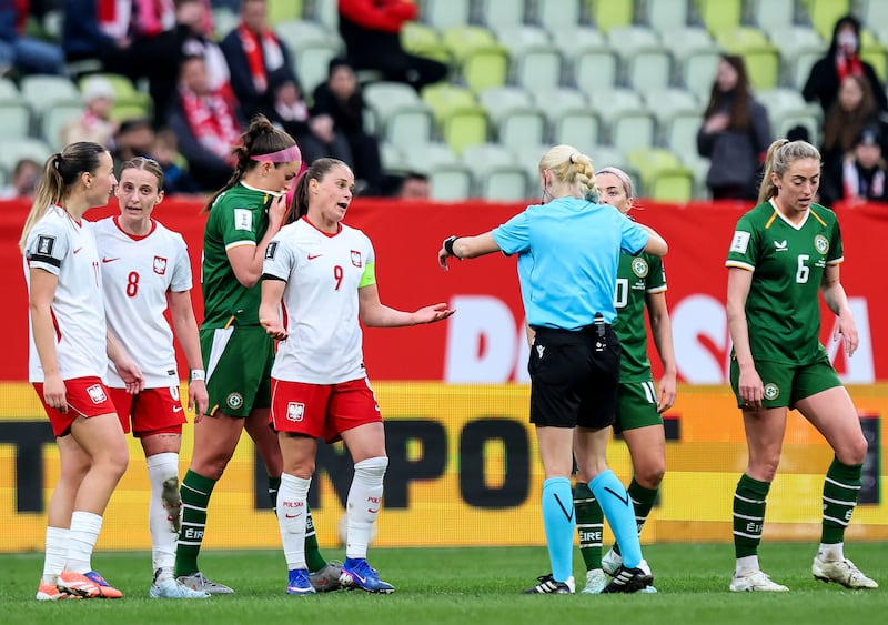 Poland’s Ewa Pajor and Ireland's Denise O'Sullivan speak to the referee. Photograph: Ryan Byrne/Inpho