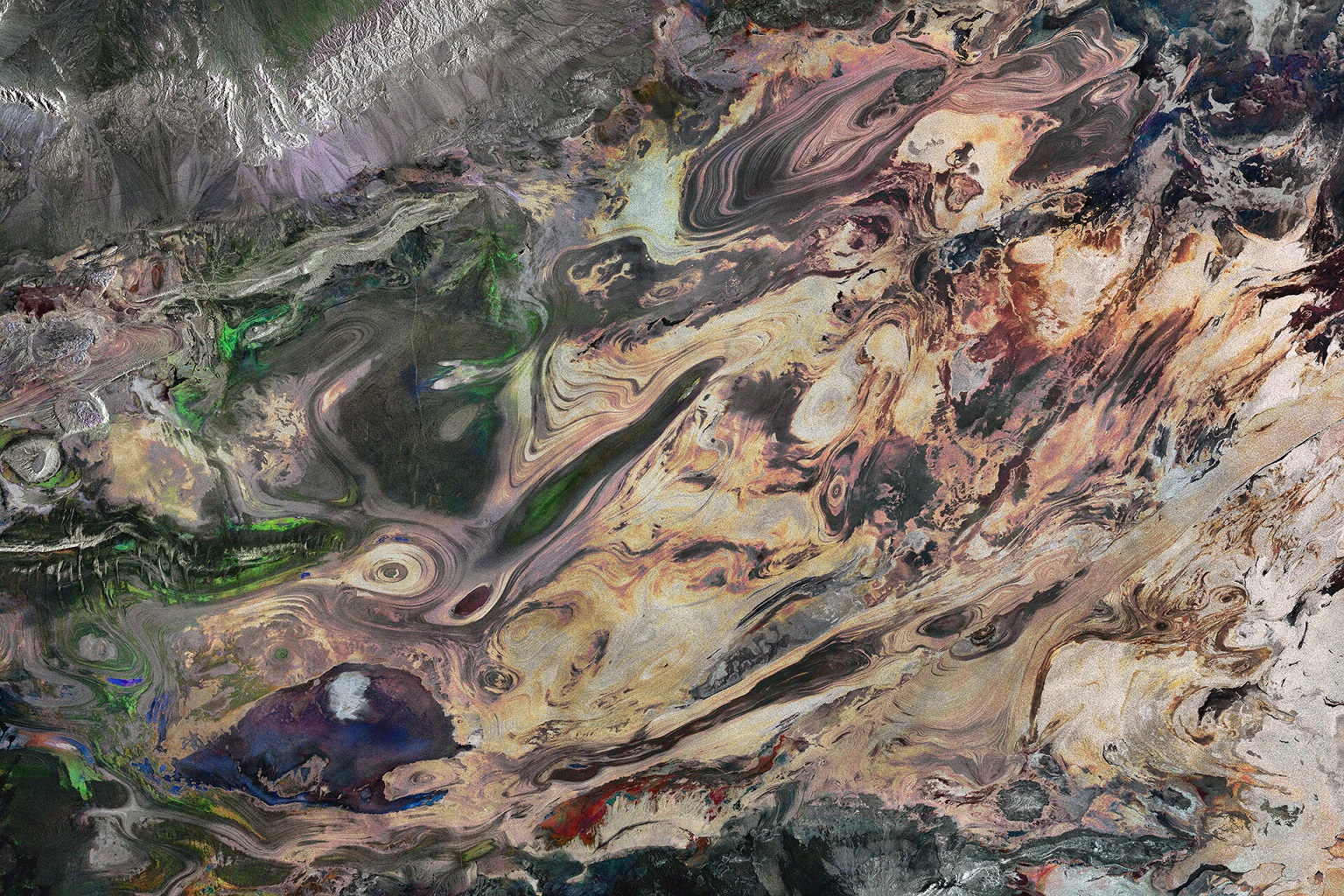 The swirling landscape of Iran’s salt desert, Dasht-e Kavir, is reminiscent of an abstract painting in this Sentinel-1 image.