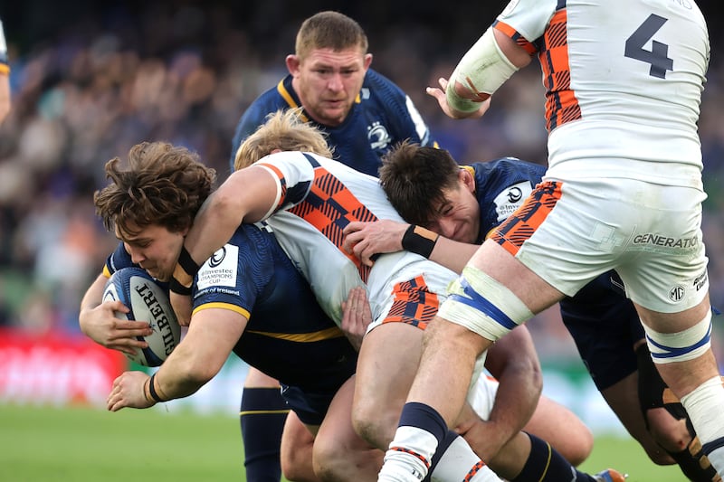 Leinster's Alex Usanov is tackled by Liam McConnell of Edinburgh. Photograph: Bryan Keane/Inpho