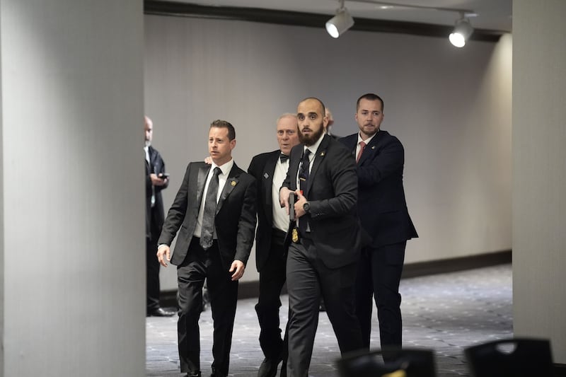 Law enforcement personnel escort attendees of the White House Correspondents' Association Dinner at the Washington Hilton Hotel. Photograph: Yuri Gripas/EPA