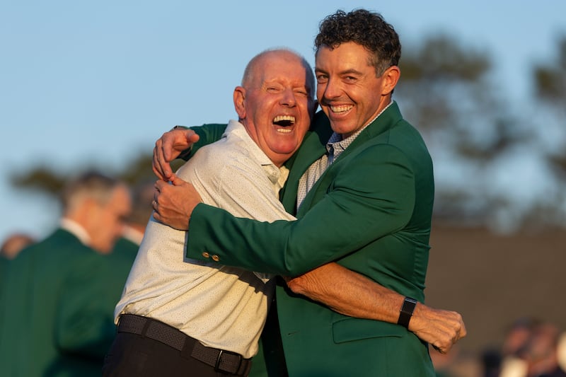 Masters champion Rory McIlroy and his father Gerry McIIroy celebrate following the final round of the Masters on Sunday. Photograph: Simon Bruty/Augusta National/Getty Images