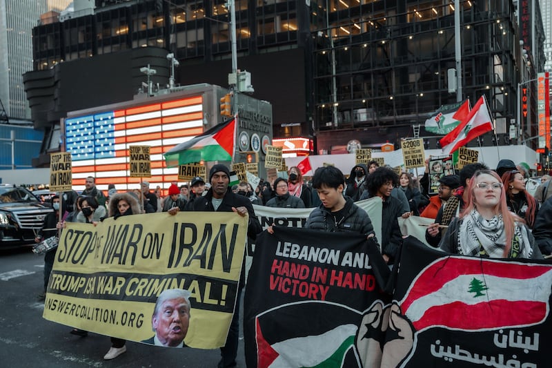 People protest against the war in Iran  in New York on Wednesday night. Photograph: Olga Fedorova/EPA