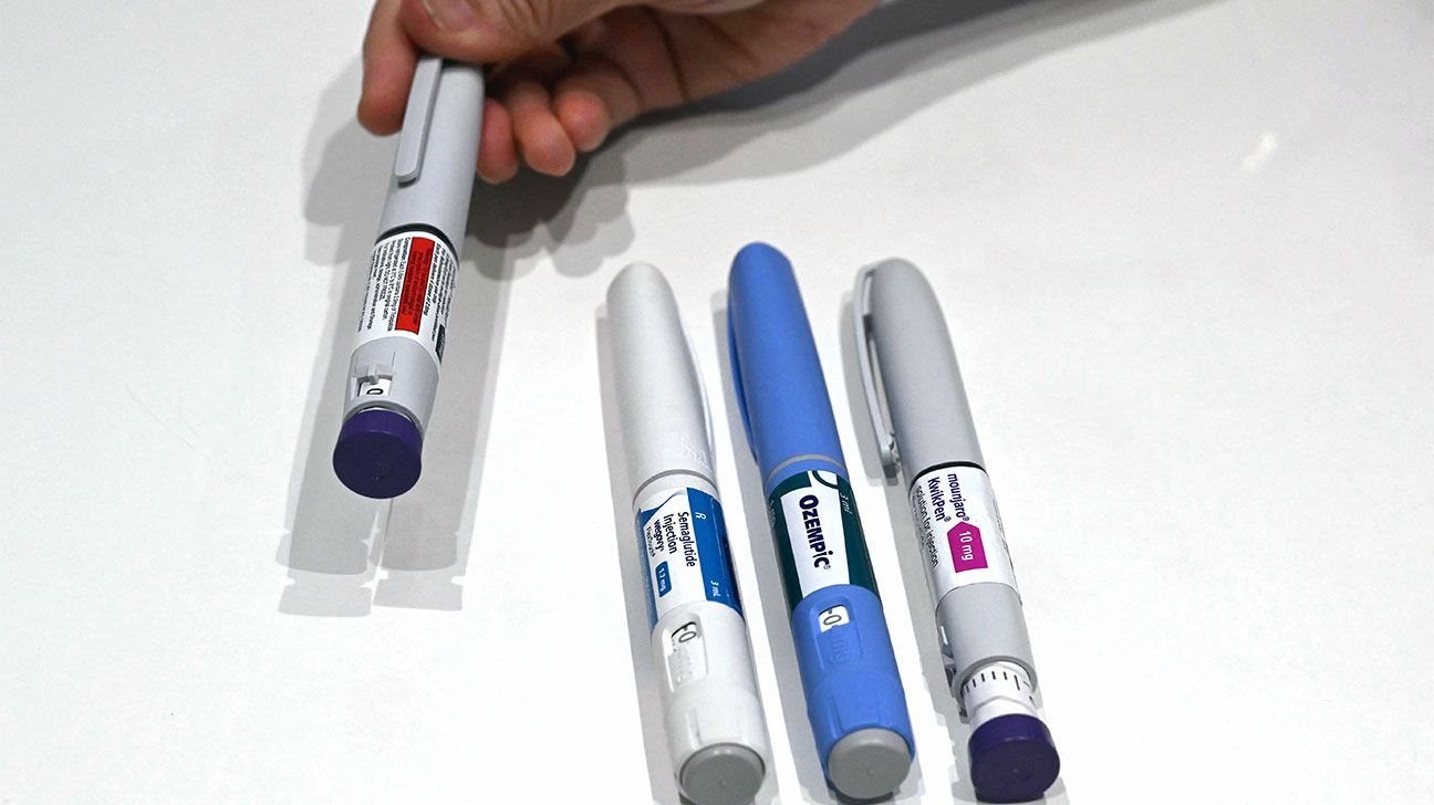 GLP-1 injection pens on a white surface