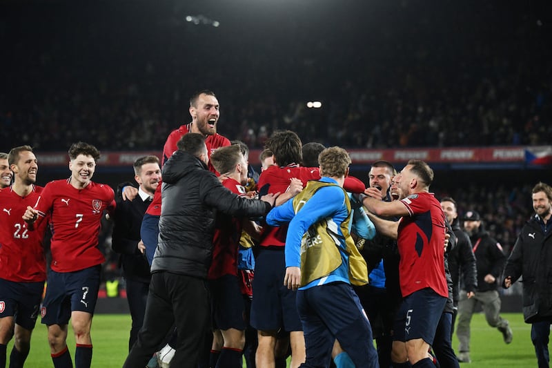 Czech Republic's forward Tomas Chory and team players celebrate after qualifying for World Cup. Photograph: Michal Cizek/AFP via Getty
