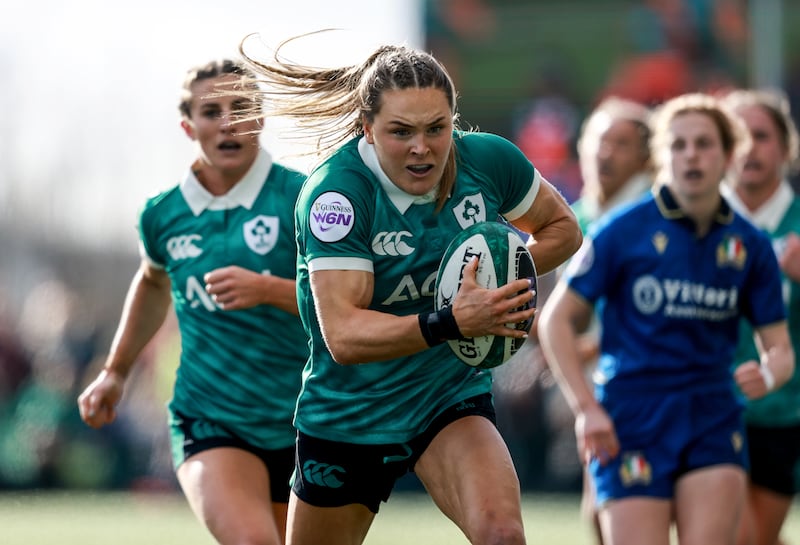 Ireland's Béibhinn Parsons on her way to scoring her third try against Italy. Photograph: Dan Sheridan/Inpho