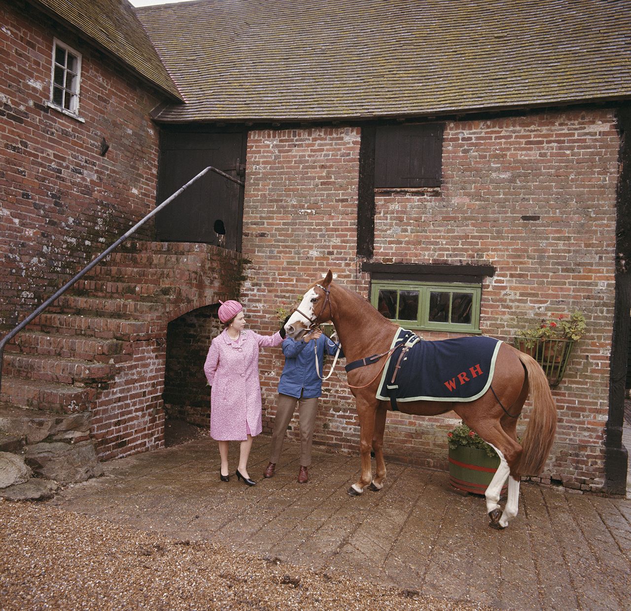 Queen Elizabeth II at Rye in Sussex with racehorse Augustine which used to belong to her 1966