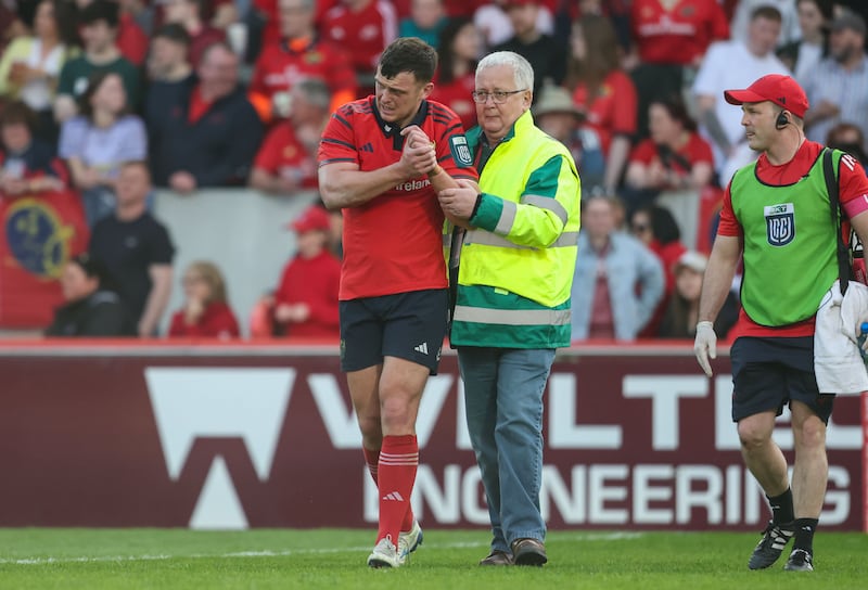 Munster's Tom Farrell leaves the pitch injured in Saturday's Munster vs Ulster game at Thomond Park. Photograph: Nick Elliott/Inpho