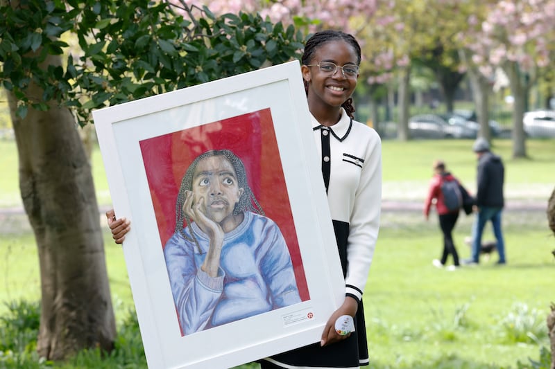 Abigail Atoyegbe and her portrait, Day Dreamer. Photograph: Nick Bradshaw