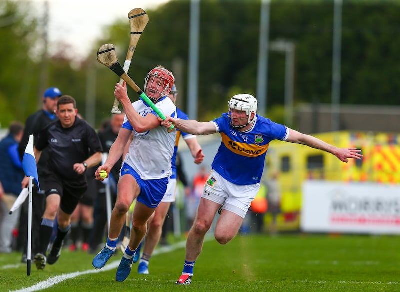 Waterford's Calum Lyons and Tipperary's Séamus Kennedy at Walsh Park on Sunday. Photograph: Inpho