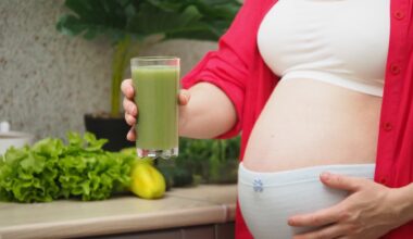 Pregnant Woman drinking green smoothie