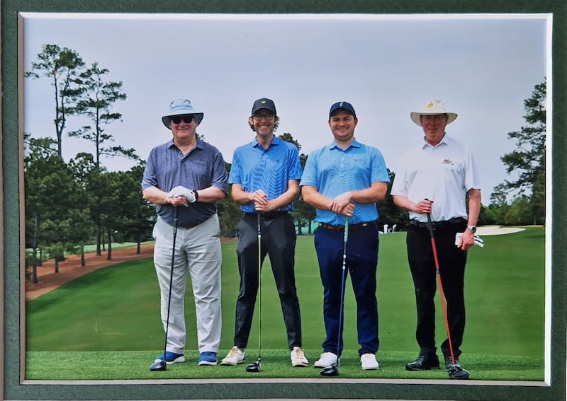 Philip Reid (pictured on right) playing golf at Augusta National