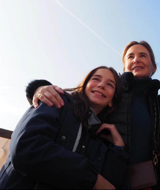 Photo of mother and daughter embracing.