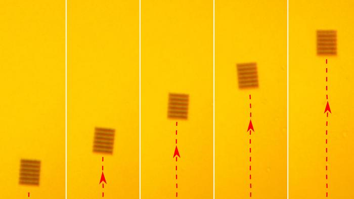 A sequence shows a metasurface “metajet” moving under laser illumination, demonstrating light driven manoeuvre (Credit: Dr. Shoufeng Lan).