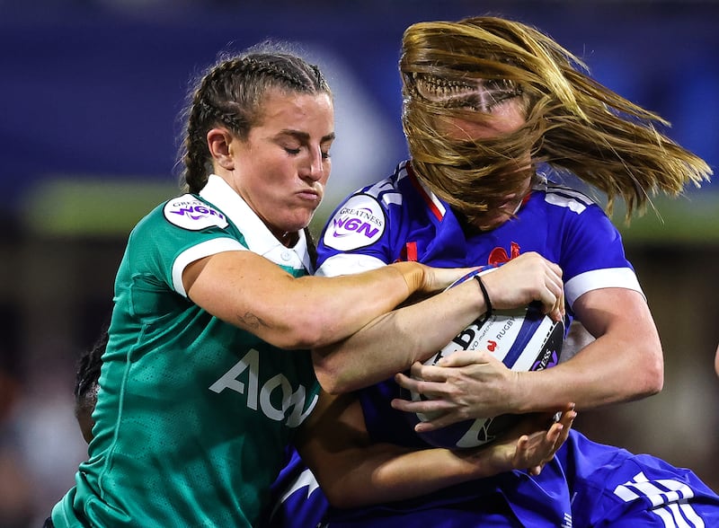 Ireland's Emily Lane tackles France’s Pauline Bourdon Sansus. Photograph: Inpho