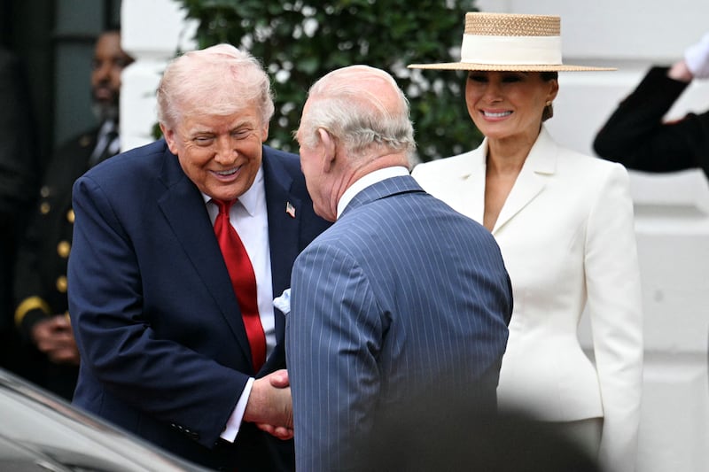 Trump greets the king outside the White House as Melania Trump looks on. Photograph: Jim Watson/AFP via Getty