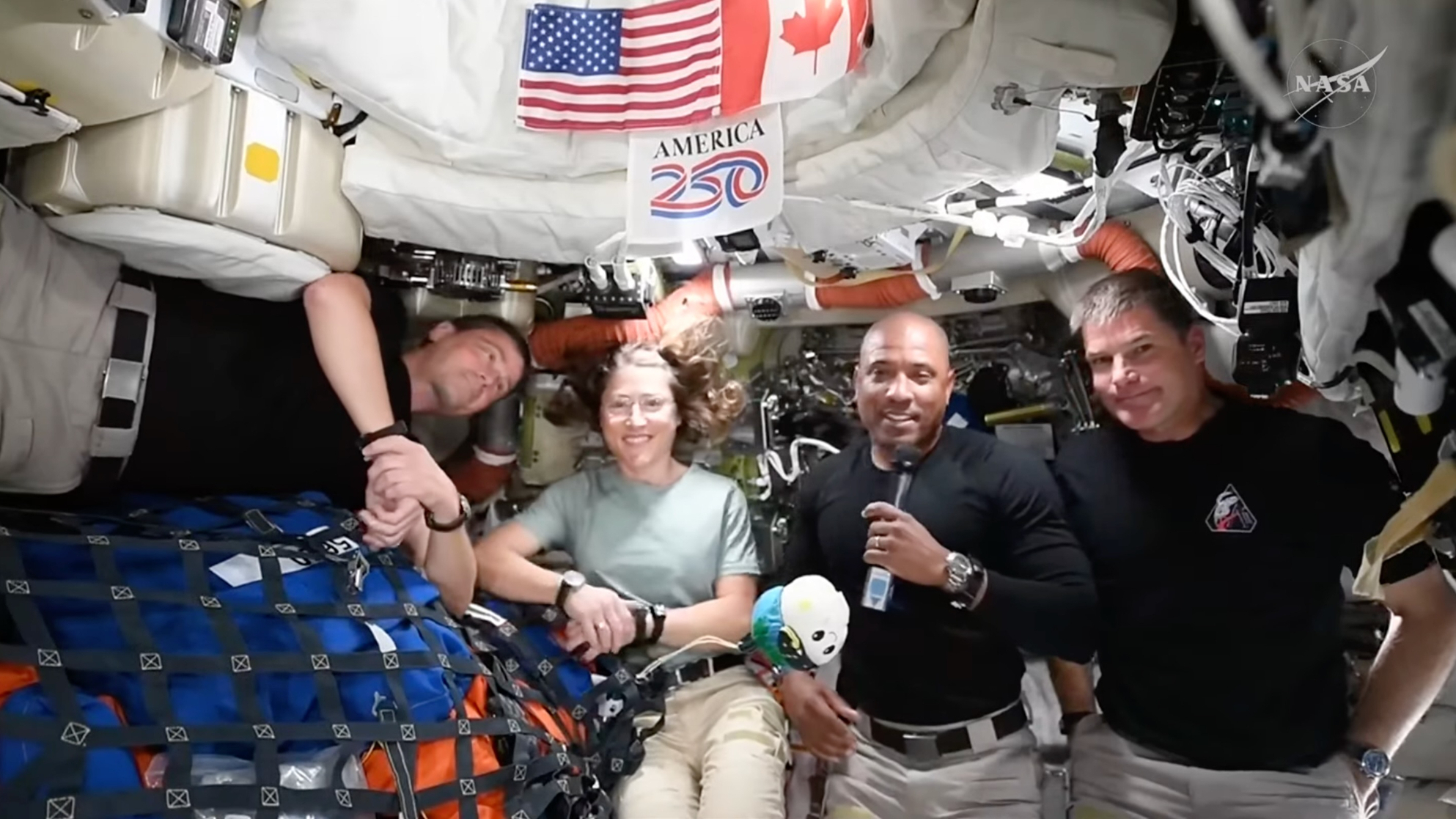 The Artemis 2 astronauts speak to reporters on April 8, 2026.