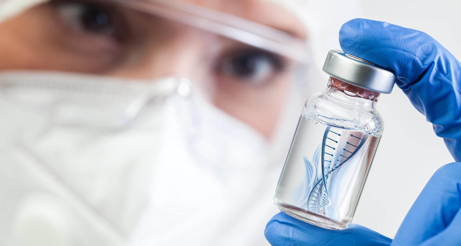 Microbiologist Biotechnician Holding mRNA Vaccine Vial