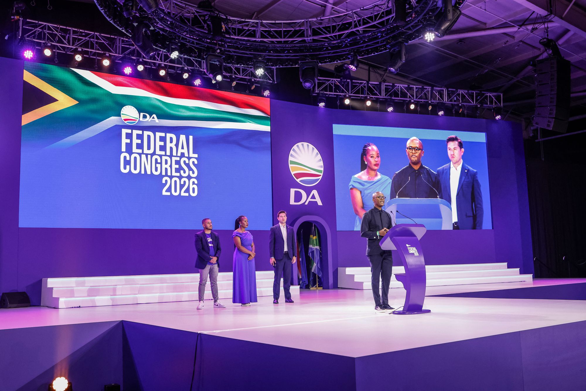 Minister of Communications and Digital Technologies of South Africa Solly Malatsi (R) speaks