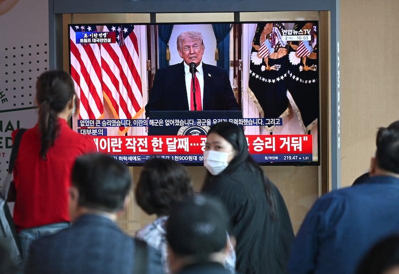 People watch a television screen showing a live broadcast of US president Donald Trump delivering a national address on the war against Iran, at a train station in Seoul on Wednesday. Photograph: by Jung Yeon-je / AFP via Getty Images