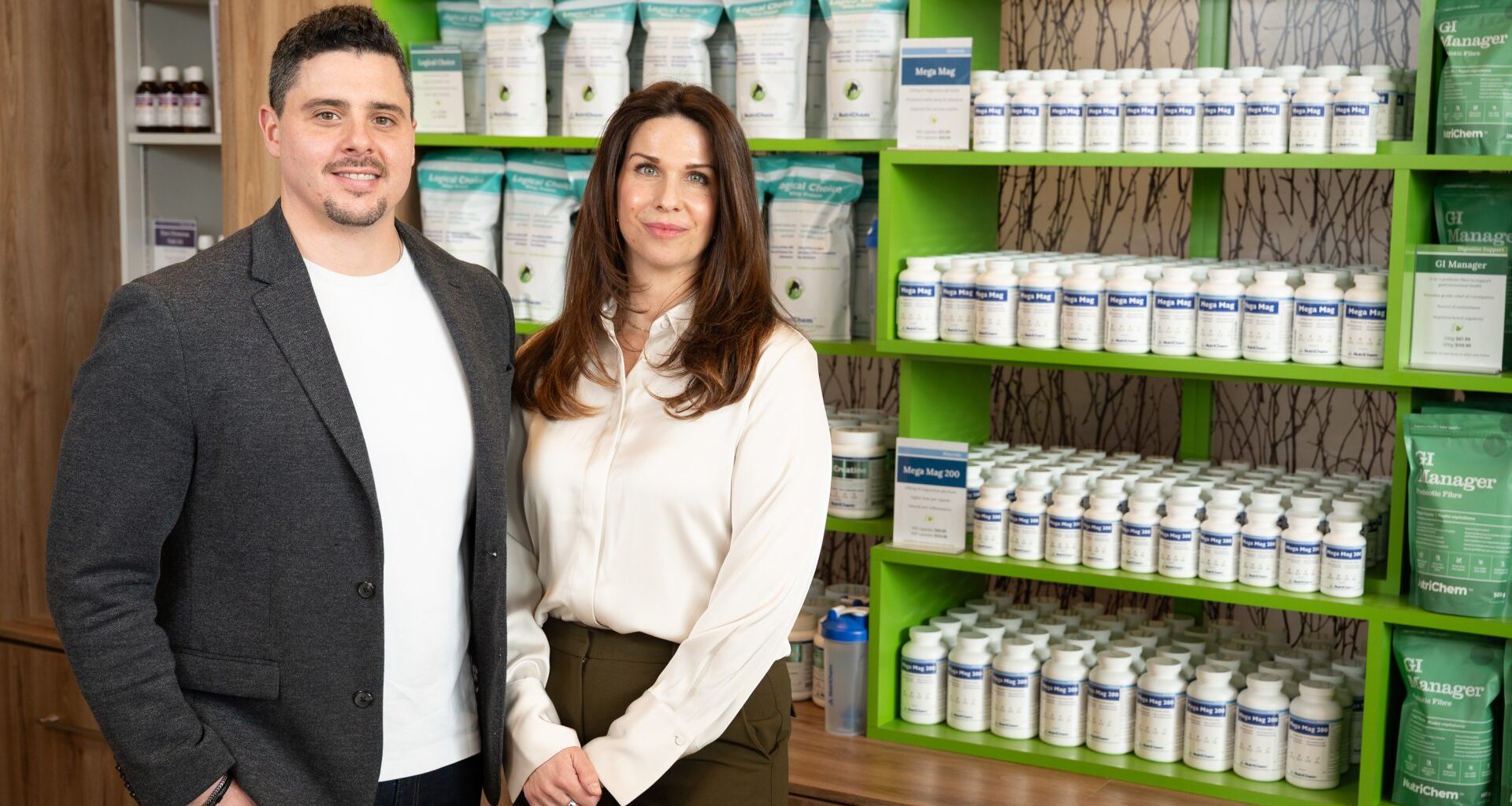 NutriChem CEO Dr. Emma Pollon-MacLeod, ND, and Director of Science Dr. Adam Livingston, PharmD, stand among the brand&rsquo;s signature supplement line, reflecting NutriChem