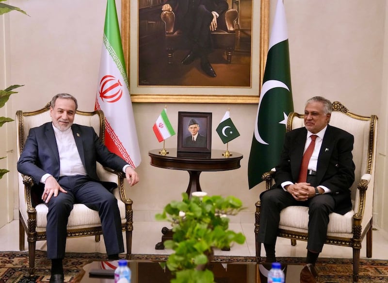 Iranian foreign minister Abbas Araghchi, left, meets Pakistan's foreign minister Ishaq Dar upon his arrival in Pakistan on Friday Photograph: Iranian Foreign Ministry via AP