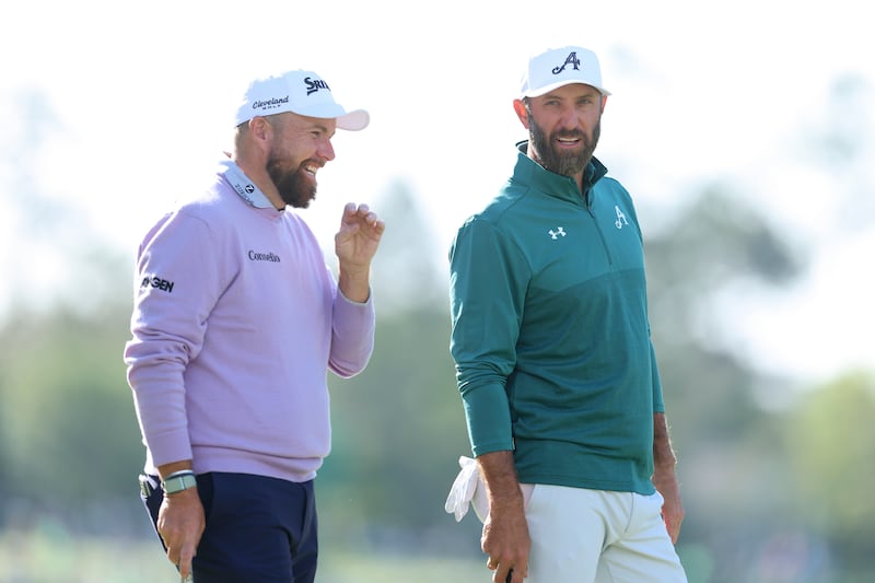 Shane Lowry and Dustin Johnson share a laugh during the first round at Augusta. Photograph:  Andrew Redington/Getty Images