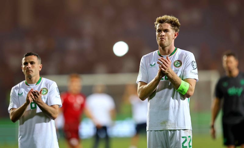 Nathan Collins, right, after Ireland's defeat to Armenia last September. Photograph: Ryan Byrne/INPHO