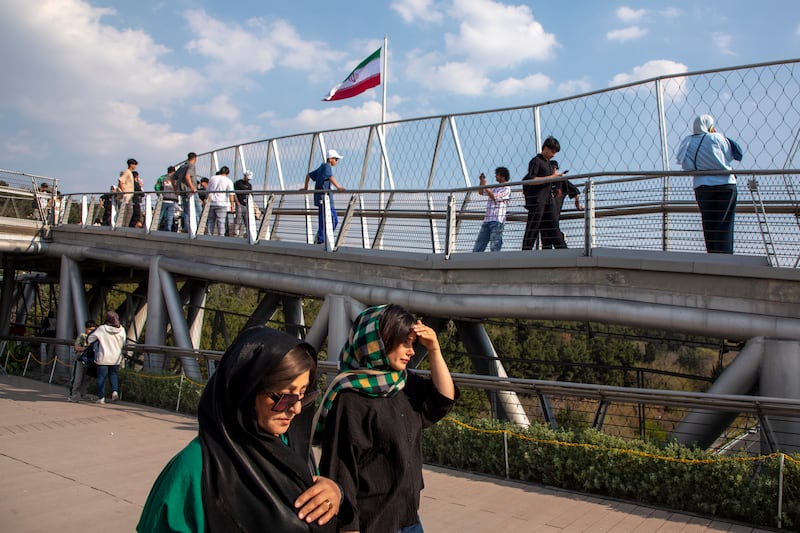 People walk along Tabiat Bridge in Tehran as Iranians celebrate Sizdah Bedar, also known as nature day, on Thursday. Photograph: Majid Saeedi/Getty Images