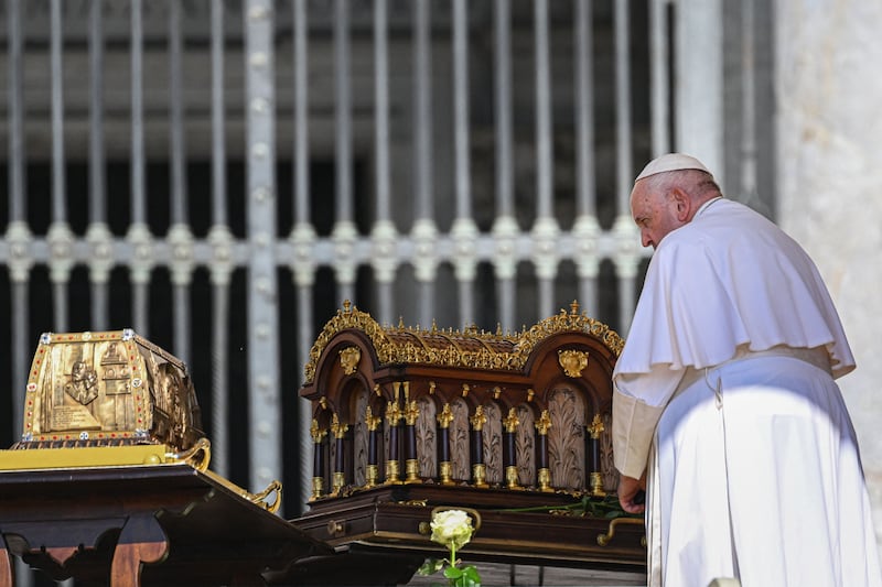 Pope Francis prays beside the relics of St Thérese of Lisieux at St Peter's Square in June 2023. Photograph: Andreas Solaro/AFP/Getty
