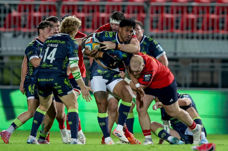 Benetton's Malakai Fekitoa is tackled by Munster's Tom Ahern and Jeremy Loughman. Photograph: Roberto Bregani/Inpho