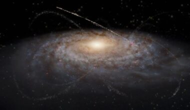 An artist&rsquo;s impression of streams of stars around a galaxy. The galaxy occupies most of the image as a fuzzy blue-white oval with spiral features extending out clockwise. The light clouds are interspersed with small dark brown splotches in the same spiral pattern around the center, representing dust clouds. The galaxy&rsquo;s center is a bright yellow glow. Overlaid on top of and surrounding the galaxy are several criss-crossing, faint tendrils of stars that represent satellite dwarf galaxies and star clusters that have been stretched out into long thin lines. The tendrils have various lengths and widths, though all are arcs rather than complete circles. The background is black.