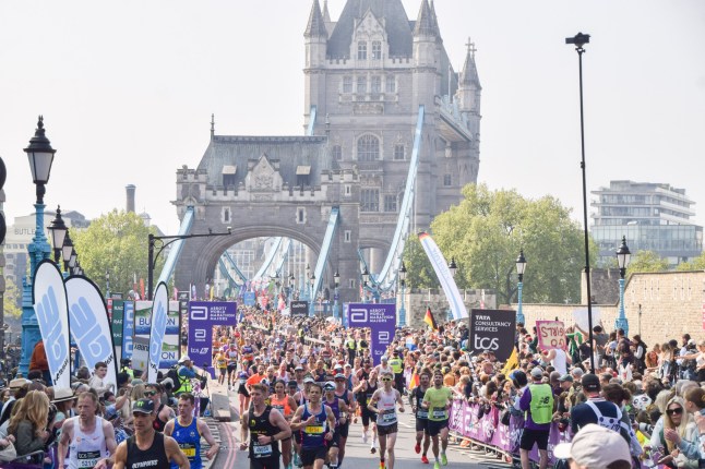 Thousands of runners pass across Tower Bridge during the London Marathon 2025. (Photo by Vuk Valcic/SOPA Images/LightRocket via Getty Images)