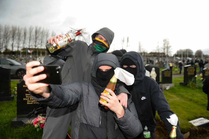 People take part in a dissident republican parade that on Monday travelled from the Creggan shops in Derry to the city cemetery. Photograph: Mark Marlow/PA Wire 