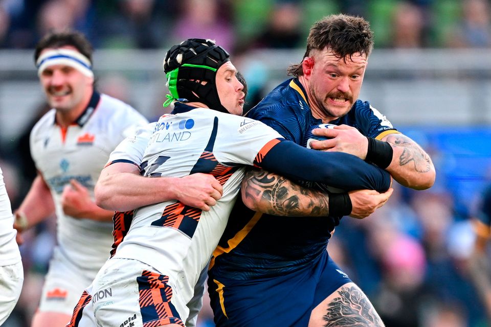 Andrew Porter of Leinster is tackled by Darcy Graham of Edinburgh