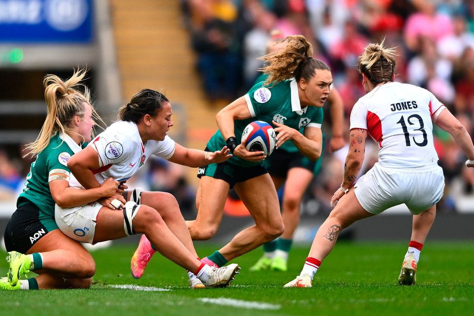 Béibhinn Parsons Ireland is tackled by Megan Jones of England during the Women's Six Nations Rugby Championship match at Twickenham, London. Photo: Shauna Clinton/Sportsfile