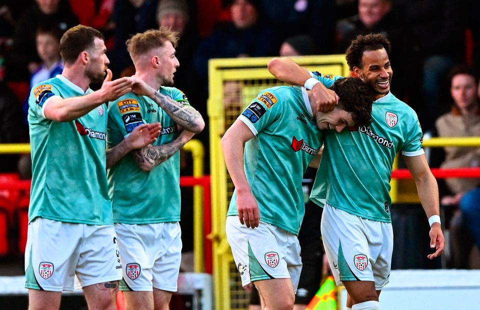 Barry Cotter of Derry City, right, celebrates scoring his side's first goal at Tolka Park. Photo: Sportsfile