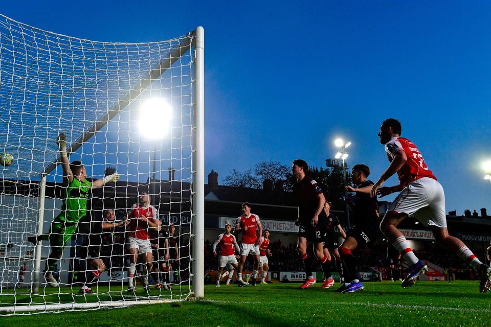 Ryan Edmondson of St Patrick's Athletic, right, scores his side's third goal past Bohemians goalkeeper Kacper Chorazka. Photo by Ben McShane/Sportsfile
